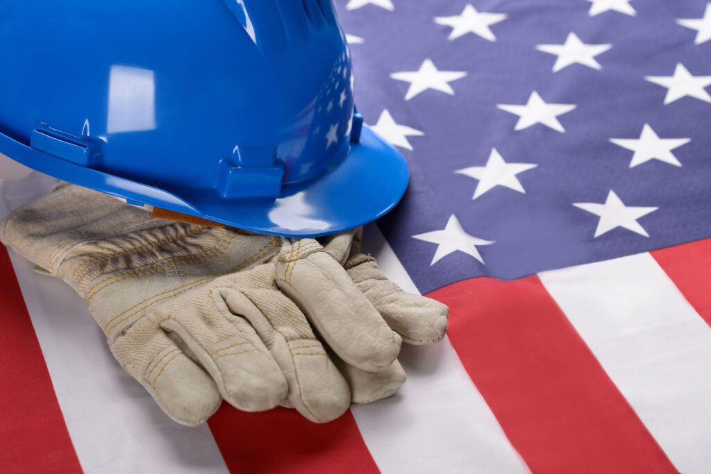 Hardhat And Gloves On American Flag