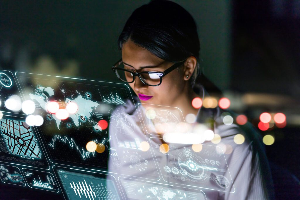 woman engineer looking at various information in screen of futuristic interface.