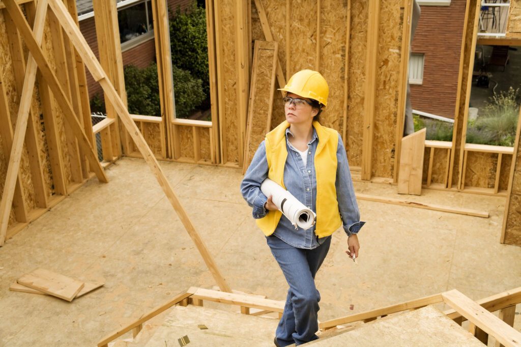 Architect Walking Through Construction Site