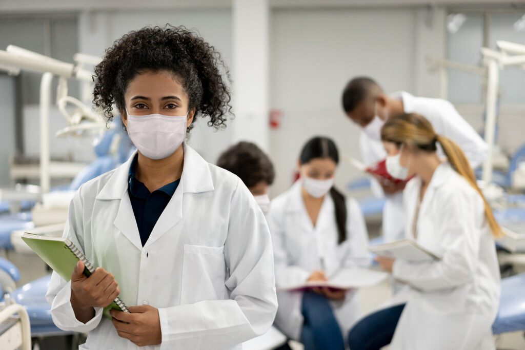 Female student back at school and wearing a facemask during the pandemic