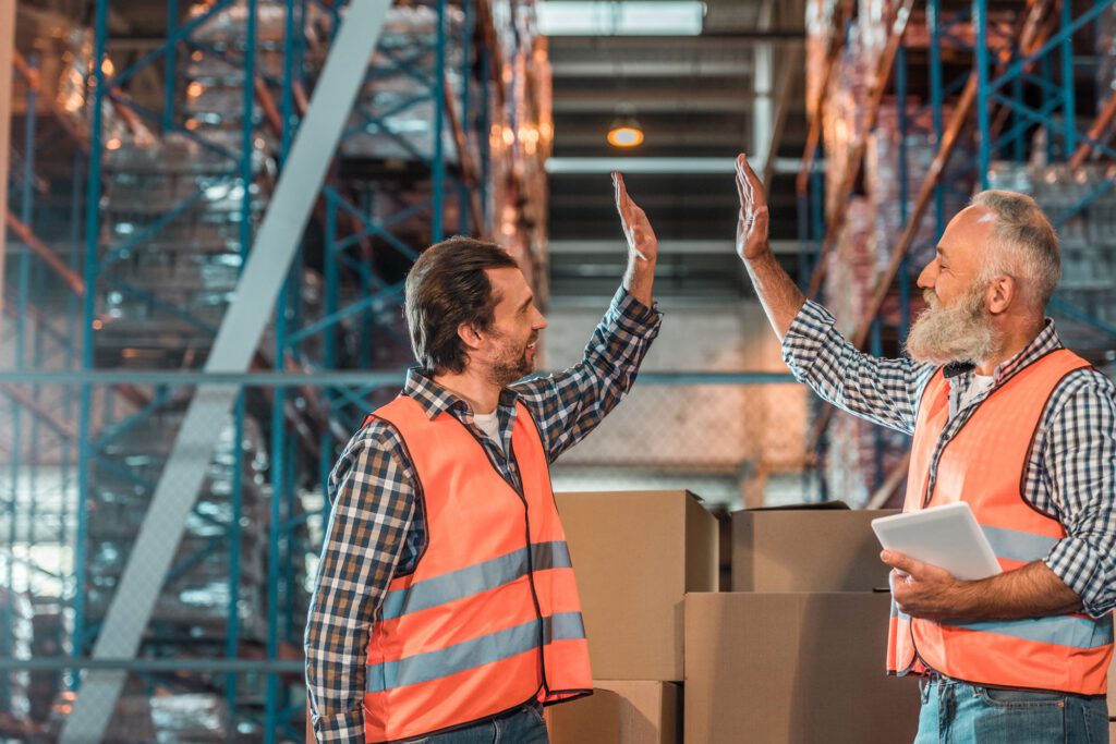 warehouse workers with digital tablet