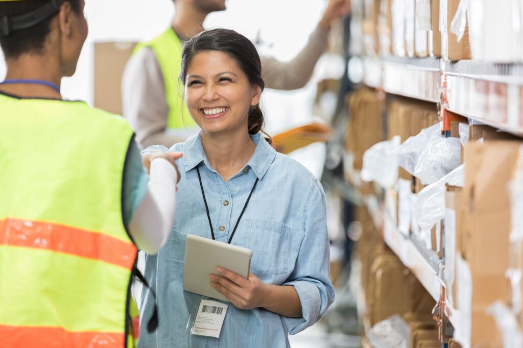 Distribution warehouse manager greets new employee