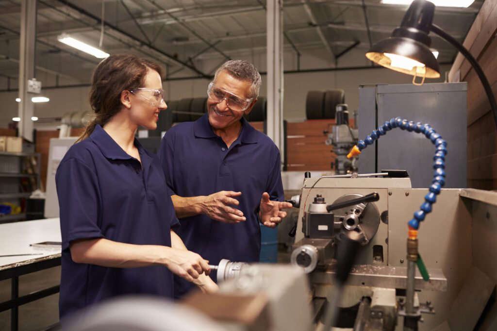 Engineer Training Female Apprentice On Milling Machine