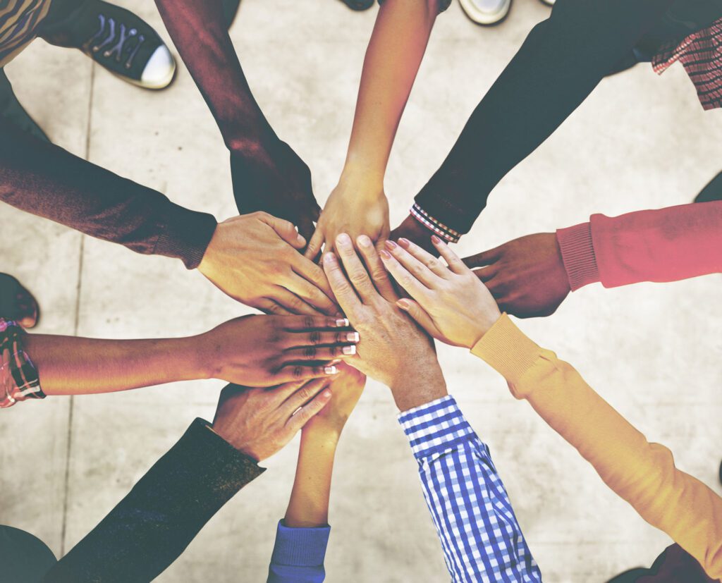 Aerial view of supported hands out together